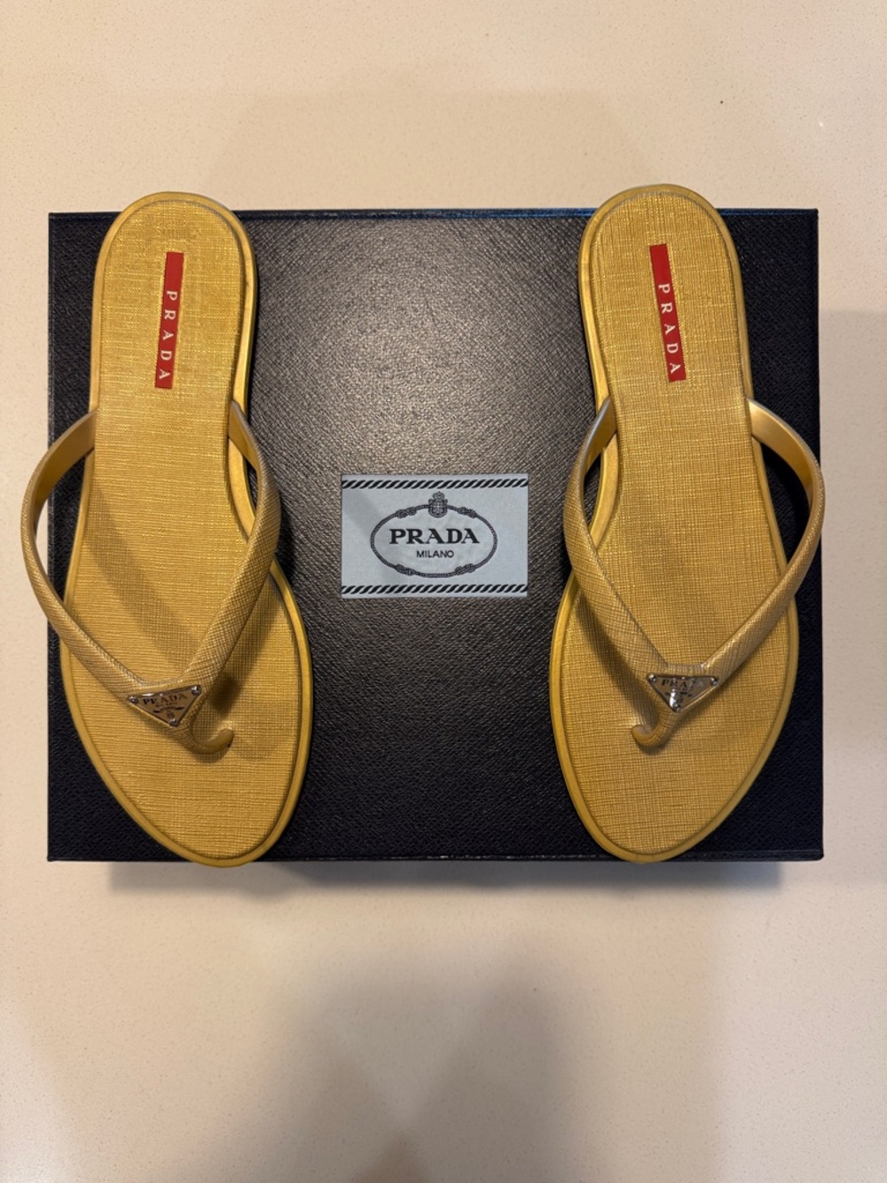 Prada Gold Textured Logo Thong Sandals